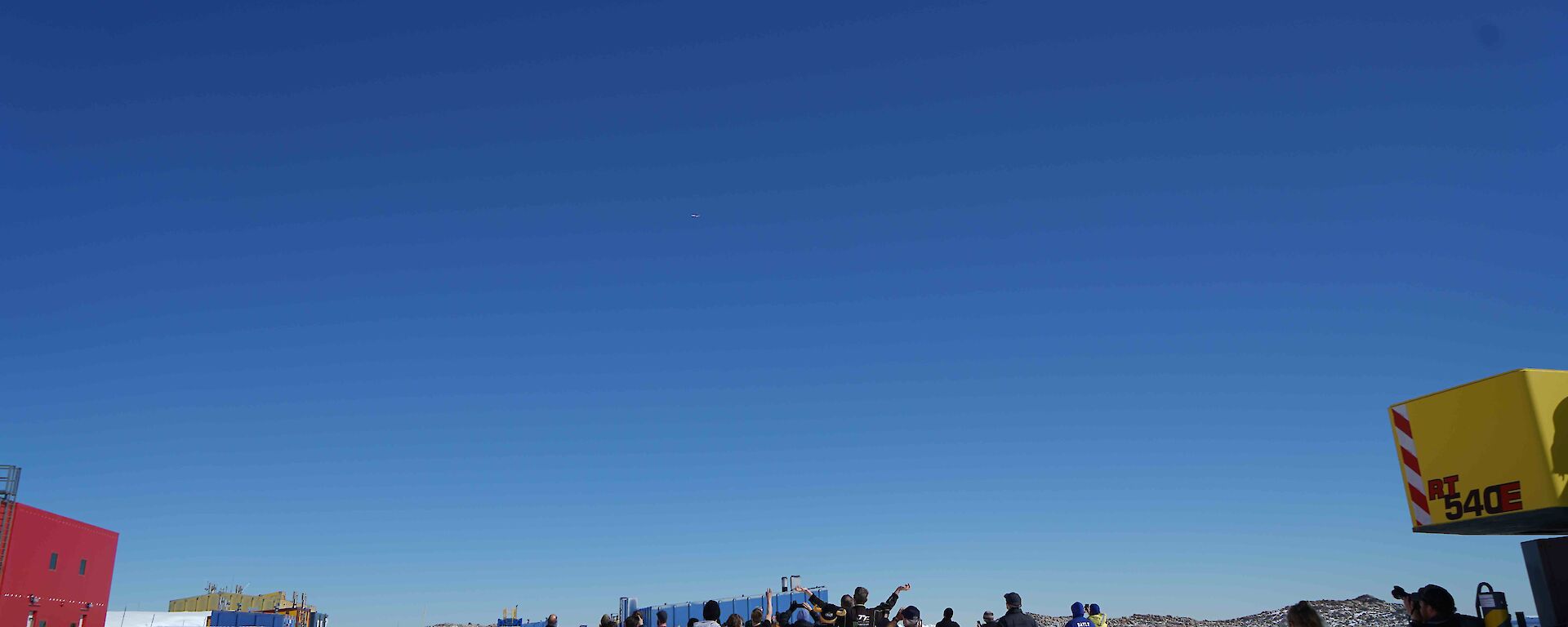 Casey expeditioners outside the Red Shed trying to spot the Qantas flight last Sunday