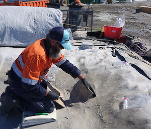 A man removing soil samples