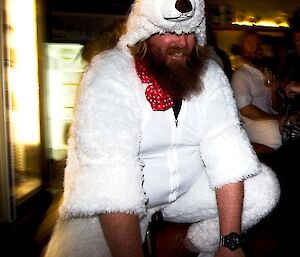 Man riding mini-bike in polar bear suit