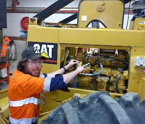 mechanic working on engine