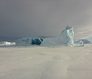 Blue ice berg in sea ice