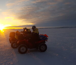 Sunset behind quad bikes in Antarctica