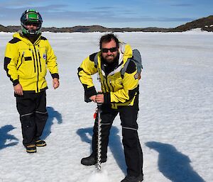 John poses for the camera while demonstrating sea-ice drilling.