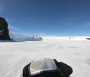 Dr Rhys’ perspective while navigating his quad bike using a map through the icy landscape