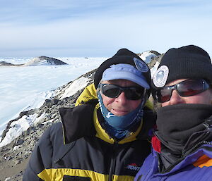 Scientists Colin and Louise stand atop their rocky island office