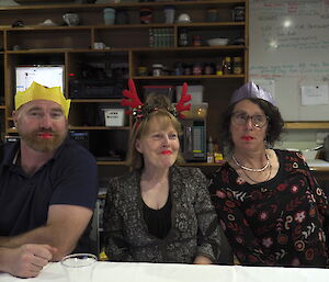 Tim, Ali and Annie wear their Christmas cracker lips