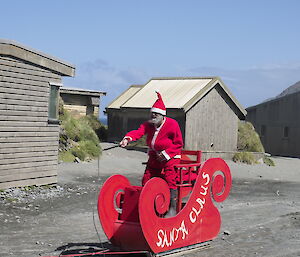 Santa arriving on his sleigh in Market Square on Macquarie Island