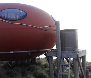 Brothers Point hut on Macquarie Island showing the collecting tube going into the water tank