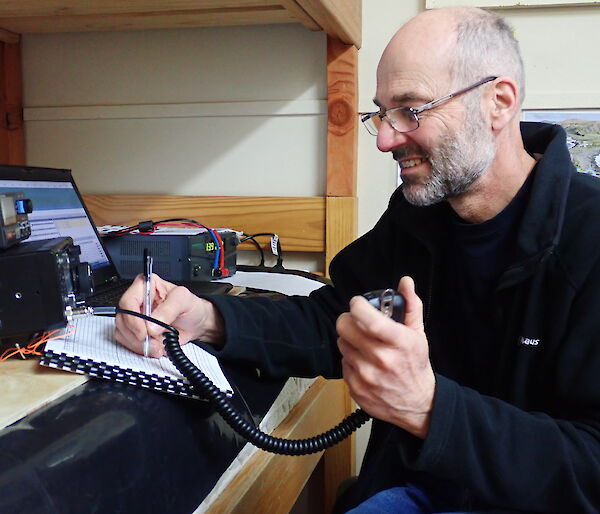 Norbert — call sign VK0AI — in the Ham Shack on the top of Hut Hill making contact with ham operators around the world.