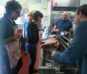 The Macca team help to prepare the spit roast lamb for out Australia Day celebrations