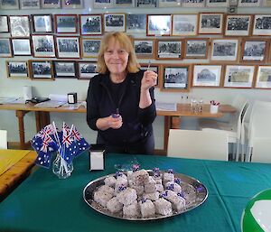 Ali adding small Aussie flags to the chocolate lamingtons for our Australia Day celebrations