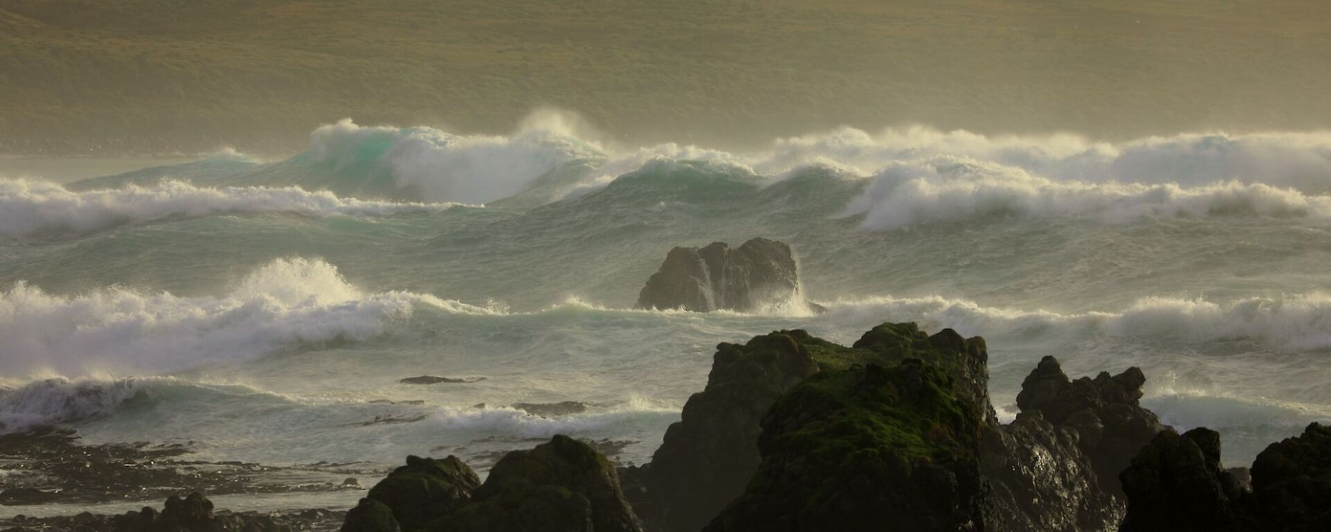 Large waves crashing on a rocky coastline