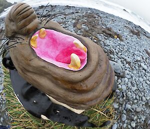 a close up of the pink mouth and teeth of an elephant seal shaped cake