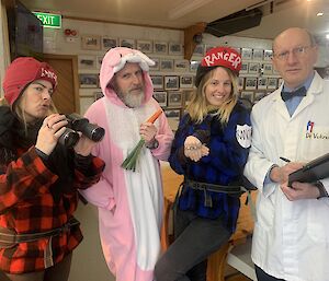Four people stand in costume — 2 are dressed as Rangers, one as a scientist and one as a fluffy bunny