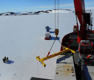 Unloading stores from icebreaker onto fast ice at research station