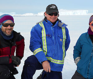 Three wildlife rangers on fast ice at Dumont Durville