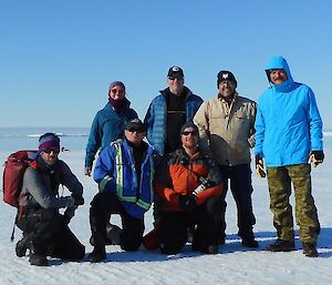 Seven expeditioners on sea ice at Dumont Durville