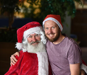 A man sits on Santa’s lap