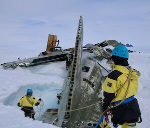 Expeditioner roped in at aircraft remains