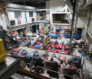 People watching a movie in the workshop