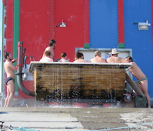 Spa overflowing due to number of people in it