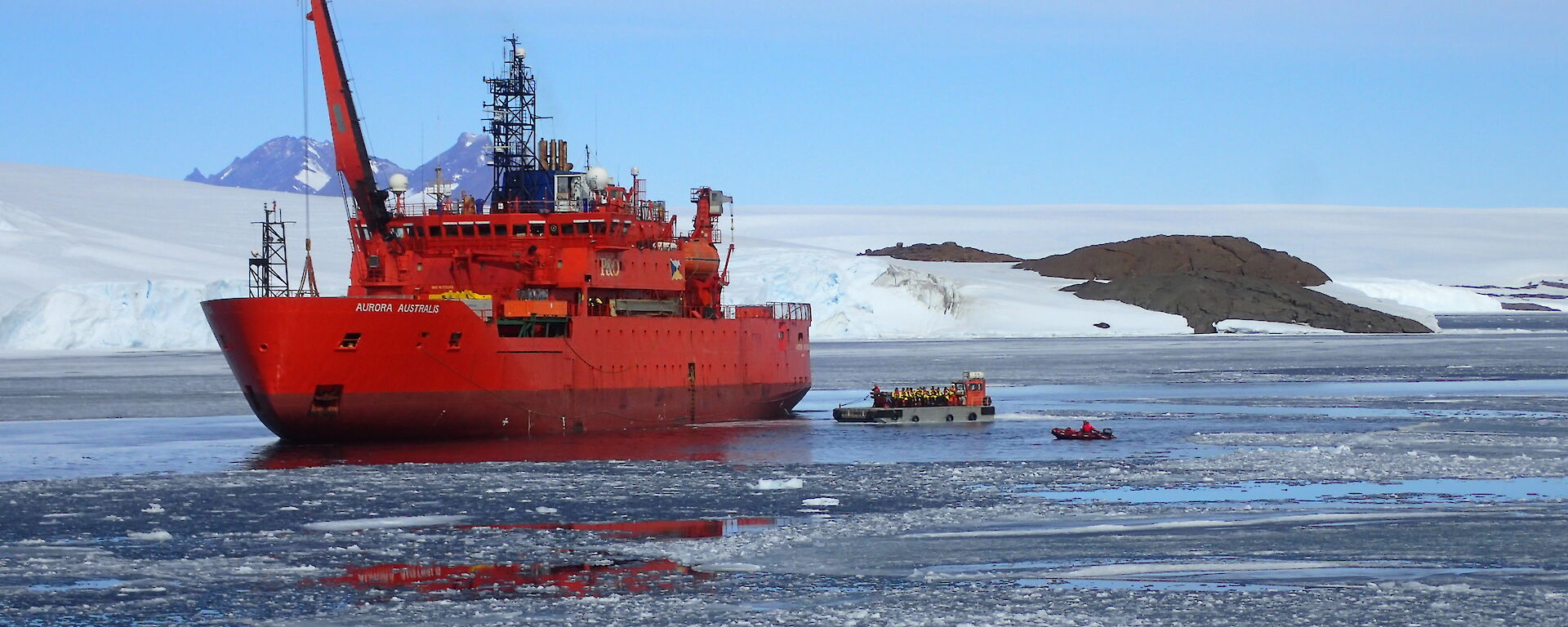 Incoming Mawson expeditioners transferring to shore via barge in Kista Strait