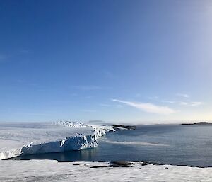 Snow landscape bathed in sunshine — west Mawson Station.