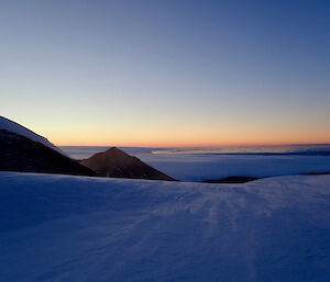 A windswept sunset from Henderson Hut — Mawson Station.