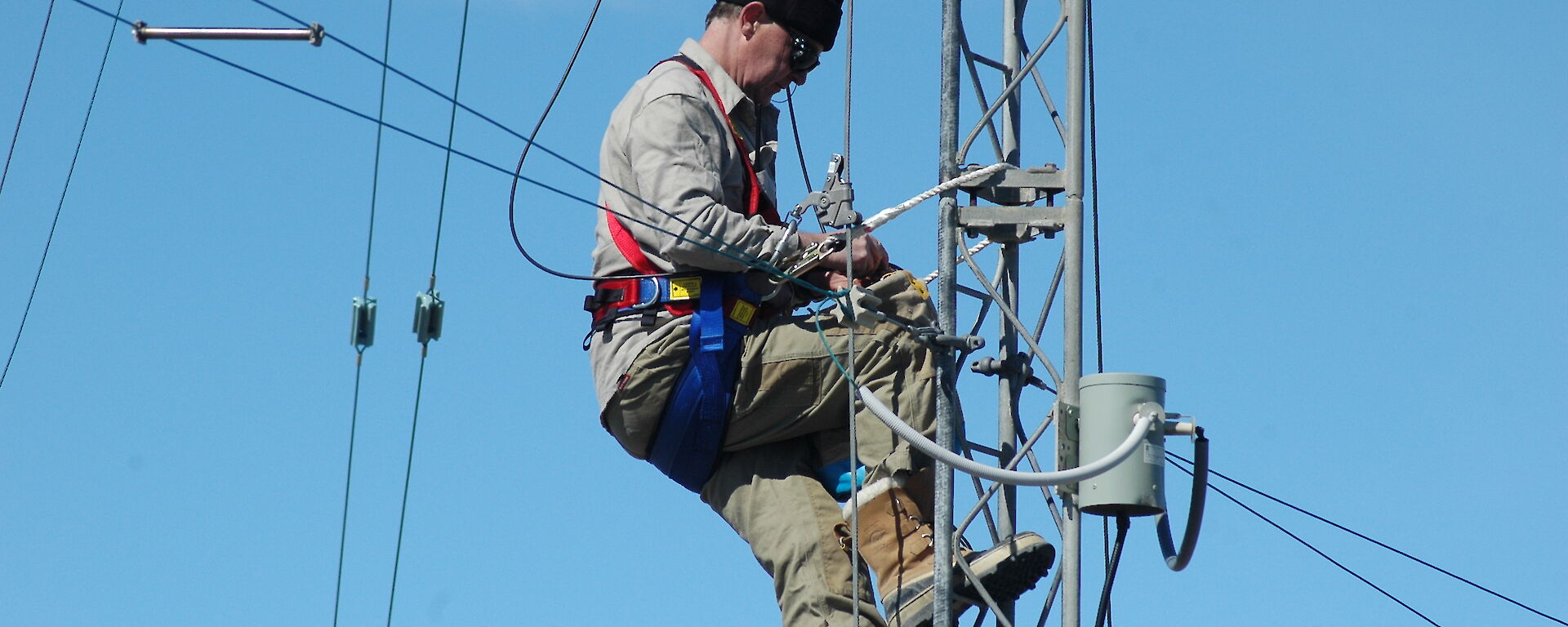 Mawson SCTO repairing a HF mast antenna.