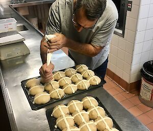 Mawson Chef Kim preparing some fresh hot-cross buns for Easter 2019.
