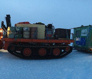 The iconic Rumdoodle field hut being towed back to Mawson Station for repairs.