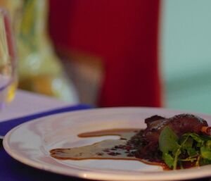 Mawson Midwinter dinner — Duck Confit with De Puy Lentil & Spinach Braise, served with Pedro Ximenez Jus — prepared by Mawson Chef Kim de Laive.