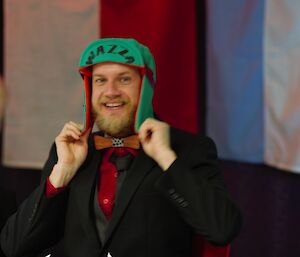 Mawson Electrician Warren Arnold receives his custom-made Antarctic Sledging Cap gift.