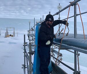 Mawson 72nd ANARE Plumber James ‘Terry’ Terrett at work on site services.