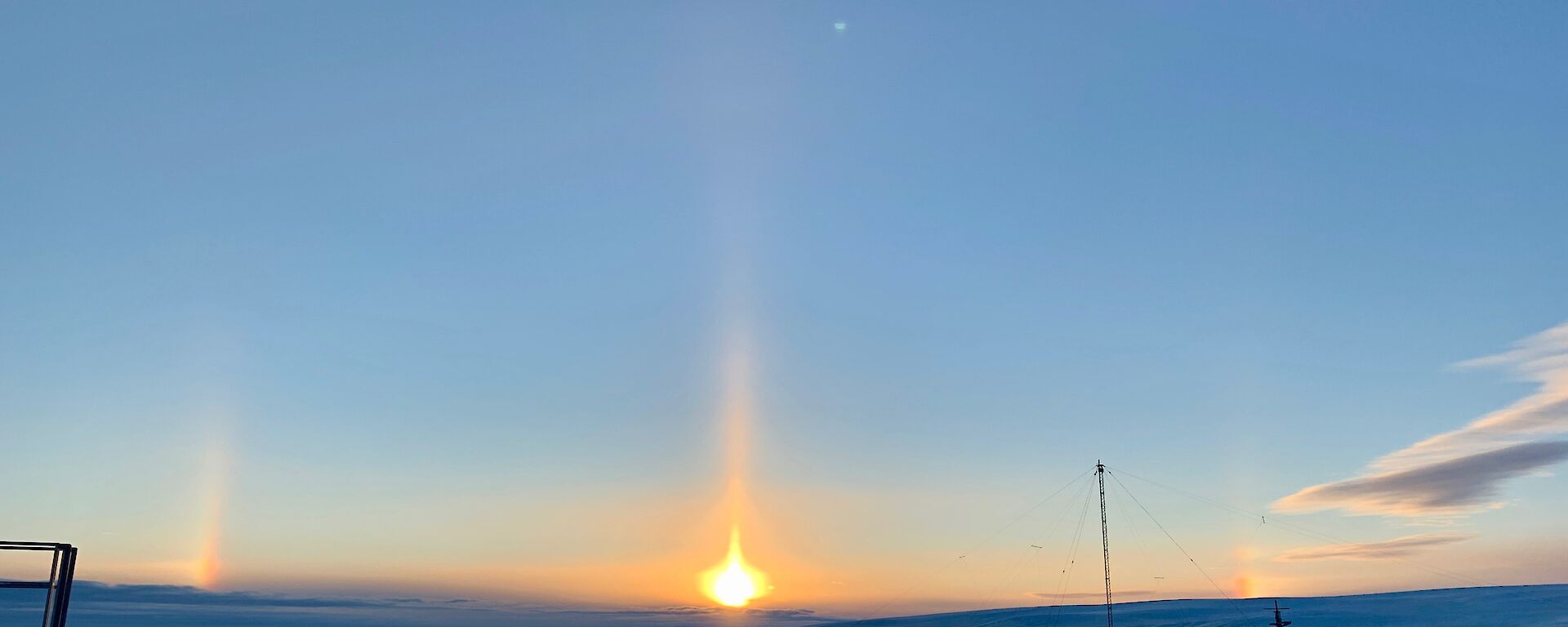 Solar pillar and developing sun dogs at sunrise — Mawson.