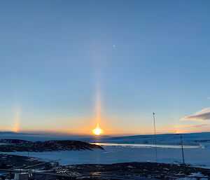 Solar pillar and developing sun dogs at sunrise — Mawson.