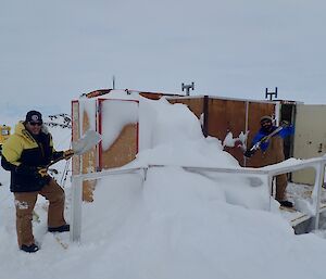 The occupational realities of ‘blizz life’ at Mawson — Mawson expeditioners preparing to dig their way into Macey Hut.