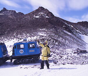 Stuart Henderson visiting his namesake peak — Mount Henderson in Mawson’s Framnes Mountains.