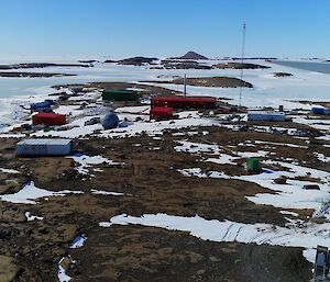 aerial view of Mawson station with wind turbine in foreground