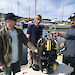 Dr Jonny Stark (left), SOSub Director Kelsey Treloar, and Dr Glenn Johnstone, with the ROV, at a wharf in Hobart.