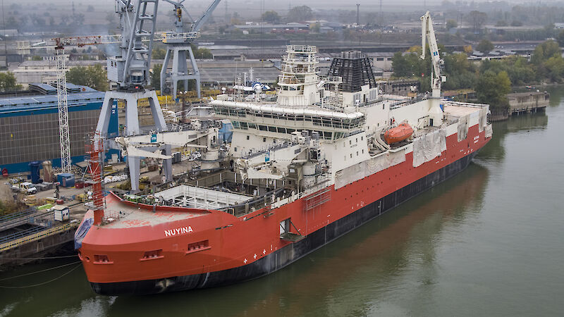 The Nuyina under construction in the river beside the Damen shipyards.