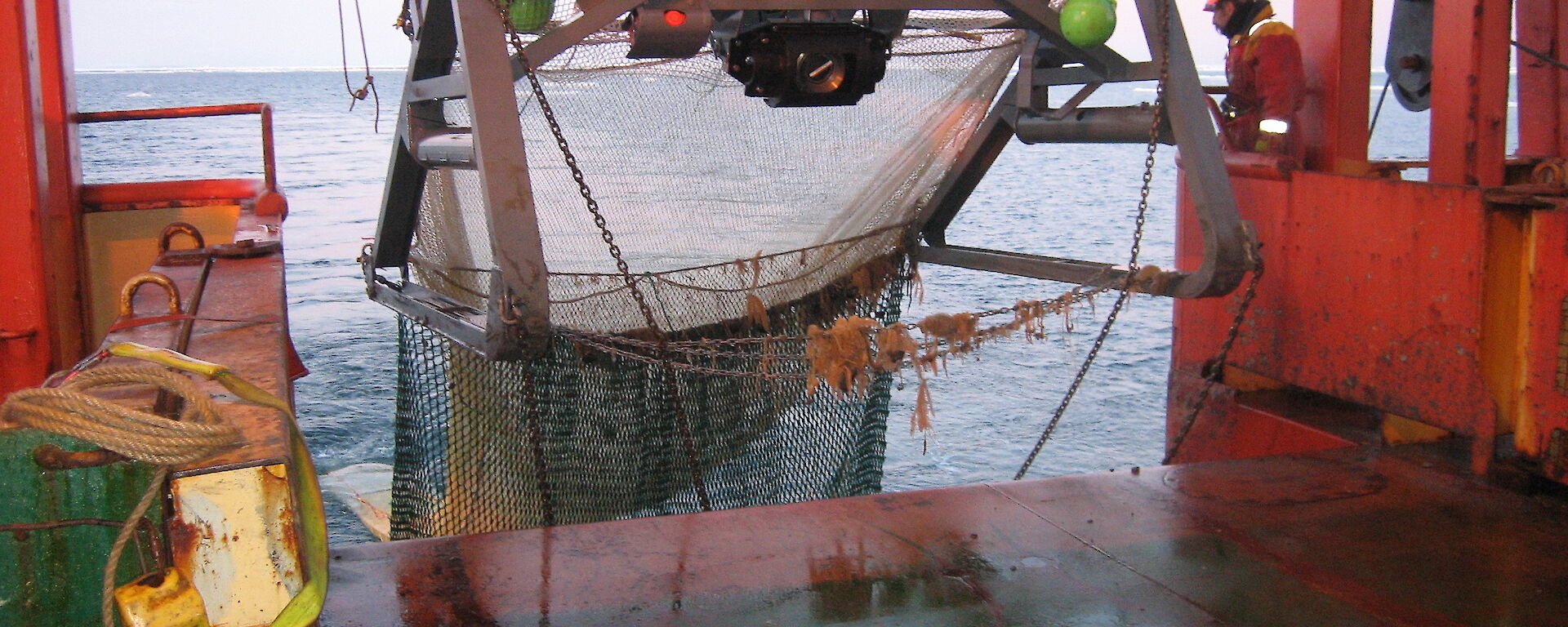A beam trawl with a camera attached being deployed from the rear deck of the Aurora Australis.
