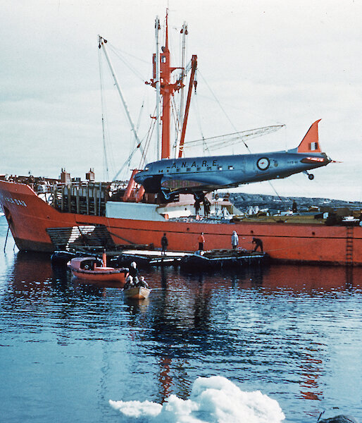 The Dakota aircraft being unloaded from the Thala Dan at Mawson in 1960.