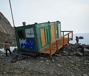 Rumdoodle Hut in a sad state after a blizzard blew out the windows and filled the living area with shattered glass and snow.