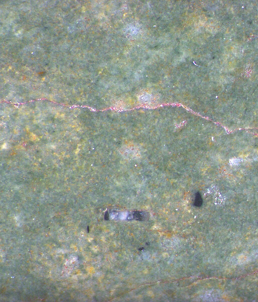 Close up view of the mineral structure of the green pendant.