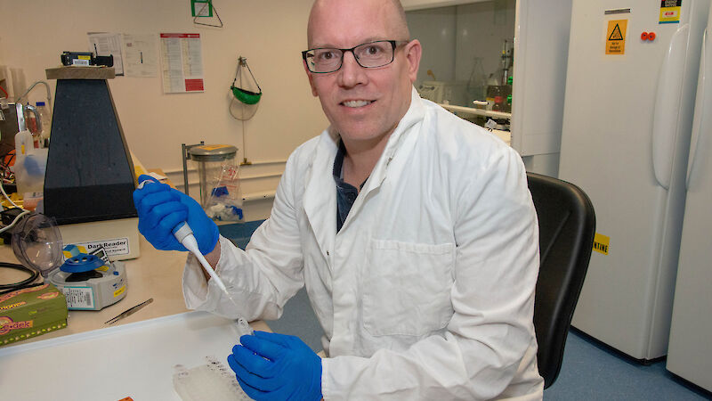 Scientist with a test tube in his laboratory.