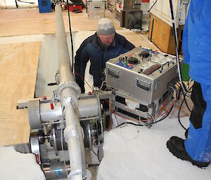 Scientist inside the drilling tent at Aurora Basin North in 2013.