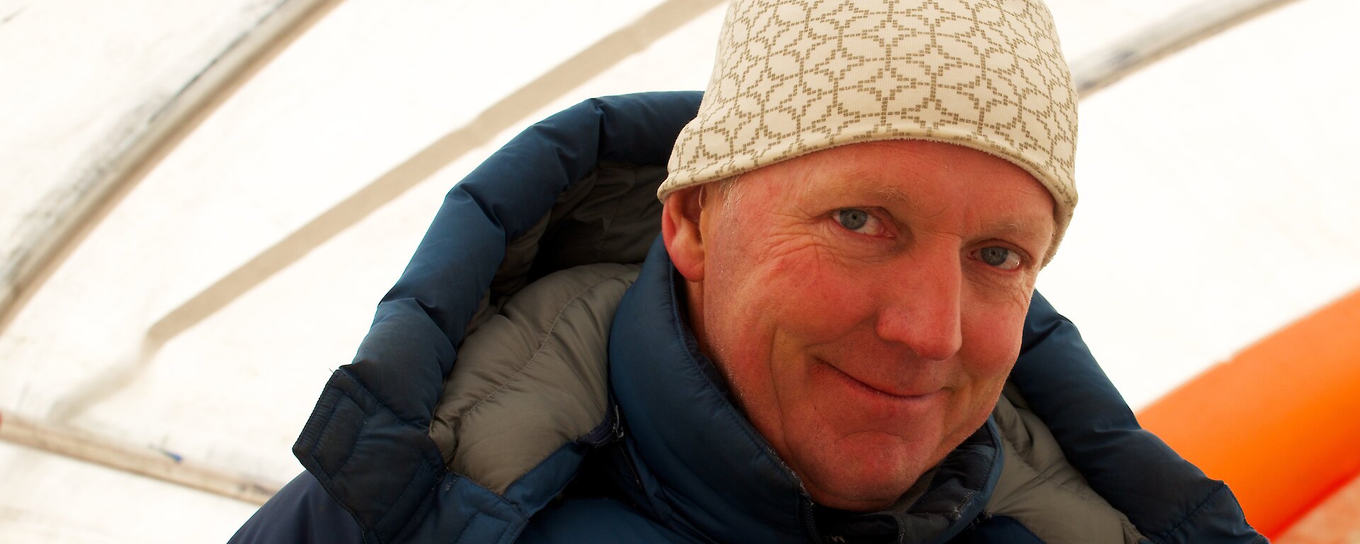 Portrait of scientist in a tent in Antarctica.