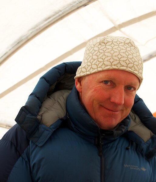 Portrait of scientist in a tent in Antarctica.