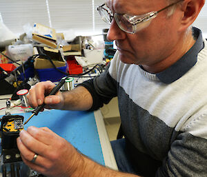 Fisheries technician works on the underwater camera.